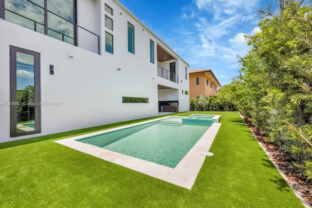 4231 SW 11th St, Miami, FL 33134 - view of swimming pool featuring a yard and a pool with connected hot tub