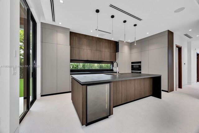 4231 SW 11th St, Miami, FL 33134 - kitchen featuring dark countertops, a sink, modern cabinets, healthy amount of natural light, and recessed lighting