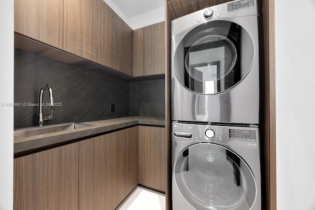 4231 SW 11th St, Miami, FL 33134 - washroom featuring stacked washer / drying machine and cabinet space