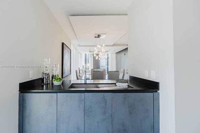 1010 Brickell Ave Unit 1501, Miami, FL 33131 - kitchen with dark countertops and a chandelier