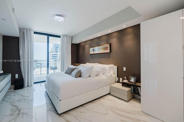 1010 Brickell Ave Unit 1501, Miami, FL 33131 - bedroom with access to exterior, light marble finish floors, an accent wall, and a wall of windows