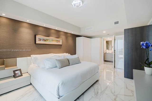 1010 Brickell Ave Unit 1501, Miami, FL 33131 - bedroom featuring light marble finish flooring, recessed lighting, and ensuite bath