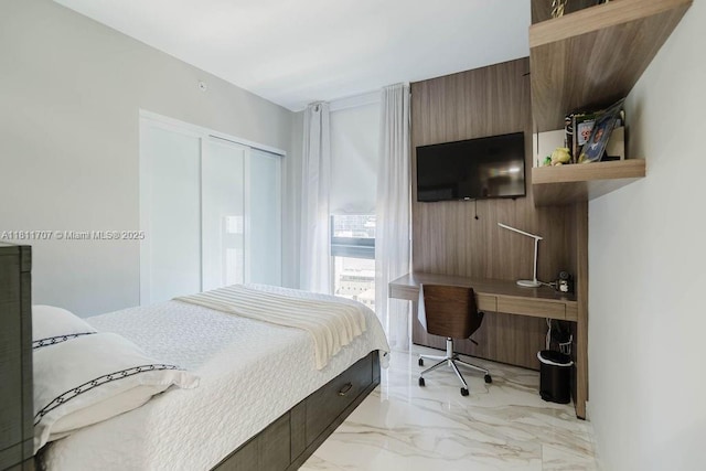 1010 Brickell Ave Unit 1501, Miami, FL 33131 - bedroom with light marble finish flooring, an office area, and a closet