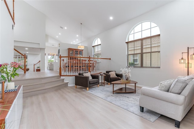 5064 SW 164th Ave, Miramar, FL 33027 - living room featuring high vaulted ceiling, wood finished floors, stairs, plenty of natural light, and recessed lighting
