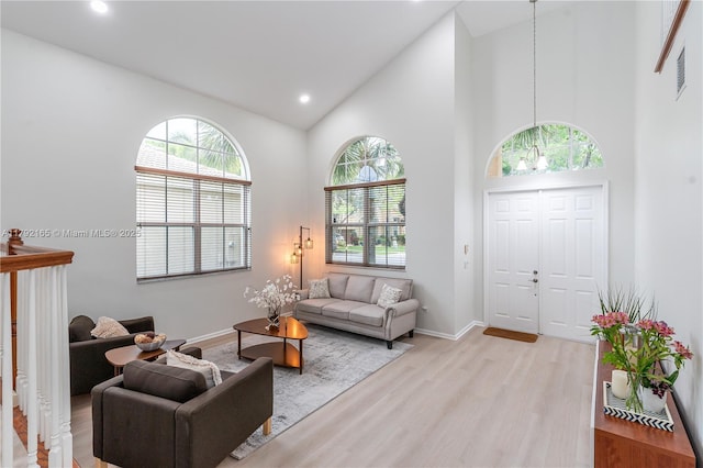5064 SW 164th Ave, Miramar, FL 33027 - living area with light wood-type flooring, healthy amount of natural light, high vaulted ceiling, baseboards, and recessed lighting