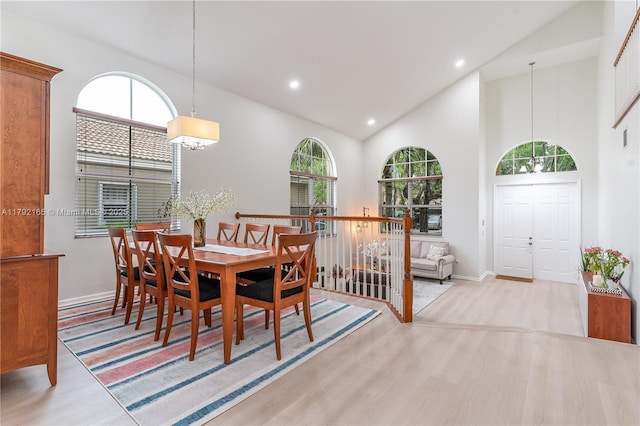 5064 SW 164th Ave, Miramar, FL 33027 - dining area featuring wood finished floors, a chandelier, baseboards, recessed lighting, and high vaulted ceiling