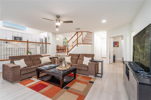 5064 SW 164th Ave, Miramar, FL 33027 - living room featuring light wood-style flooring, stairs, and ceiling fan
