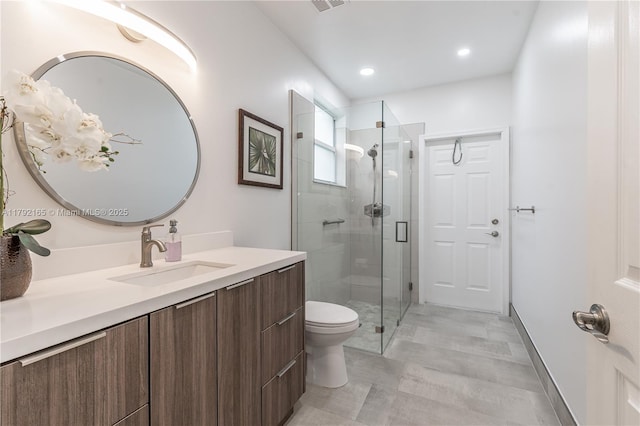 5064 SW 164th Ave, Miramar, FL 33027 - bathroom featuring vanity, toilet, a shower stall, recessed lighting, and baseboards