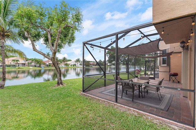 5064 SW 164th Ave, Miramar, FL 33027 - view of green lawn with a water view, a patio area, and glass enclosure