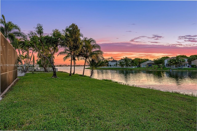 5064 SW 164th Ave, Miramar, FL 33027 - yard at dusk featuring a water view and a lawn