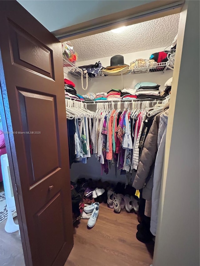 9577 W Mcnab Rd Unit 110, Tamarac, FL 33321 - walk in closet with wood finished floors