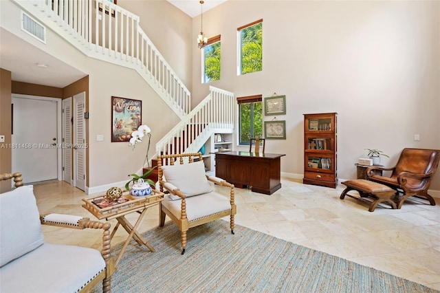 8205 SW 171st Ter, Palmetto Bay, FL 33157 - living area featuring a towering ceiling and stairs
