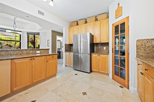 8205 SW 171st Ter, Palmetto Bay, FL 33157 - kitchen featuring freestanding refrigerator, decorative backsplash, dark stone countertops, and pendant lighting