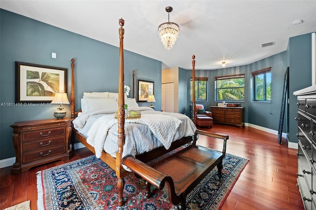 8205 SW 171st Ter, Palmetto Bay, FL 33157 - bedroom featuring a chandelier and wood finished floors
