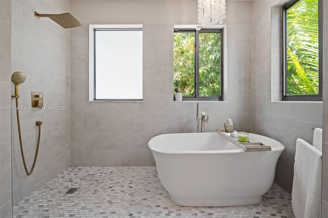 8205 SW 171st Ter, Palmetto Bay, FL 33157 - full bathroom with tiled shower, a freestanding bath, and tile walls