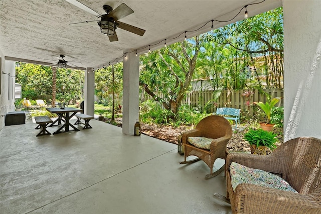 8205 SW 171st Ter, Palmetto Bay, FL 33157 - fenced backyard featuring outdoor dining space, ceiling fan, and a patio