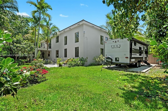 8205 SW 171st Ter, Palmetto Bay, FL 33157 - rear view of house featuring stucco siding, a patio, and a balcony