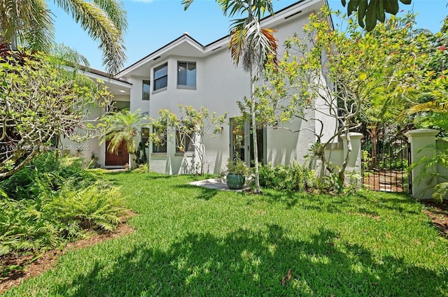 8205 SW 171st Ter, Palmetto Bay, FL 33157 - rear view of house featuring stucco siding and a yard