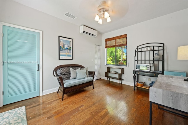 8205 SW 171st Ter, Palmetto Bay, FL 33157 - sitting room with an AC wall unit and wood finished floors