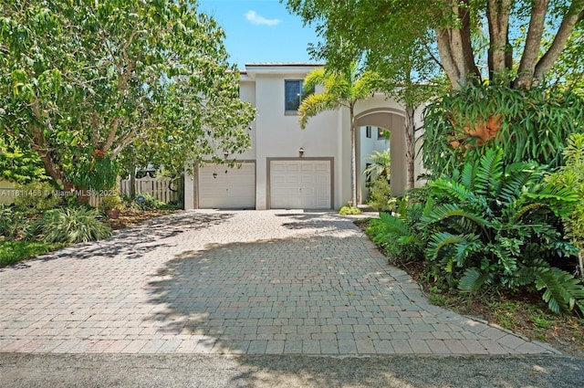 8205 SW 171st Ter, Palmetto Bay, FL 33157 - view of front of home with decorative driveway, stucco siding, and an attached garage