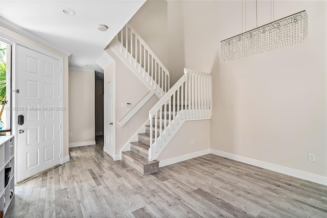 21024 NE 34th Ct, Aventura, FL 33180 - entryway with stairway, wood finished floors, baseboards, and ornamental molding