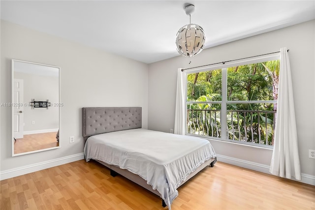 21024 NE 34th Ct, Aventura, FL 33180 - bedroom featuring wood finished floors and baseboards