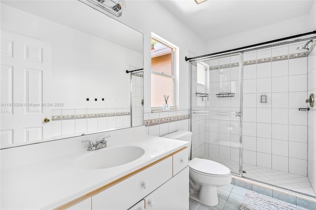 21024 NE 34th Ct, Aventura, FL 33180 - full bathroom with a shower stall, toilet, vanity, tile patterned floors, and tile walls