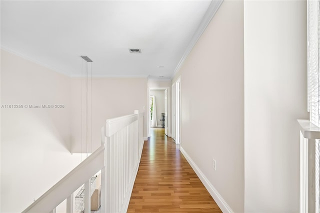 21024 NE 34th Ct, Aventura, FL 33180 - hallway featuring an upstairs landing, light wood-style flooring, ornamental molding, and baseboards