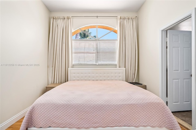 21024 NE 34th Ct, Aventura, FL 33180 - bedroom featuring wood finished floors and baseboards