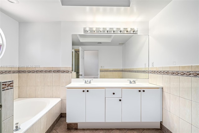 21024 NE 34th Ct, Aventura, FL 33180 - full bath featuring tile walls, a garden tub, tile patterned flooring, double vanity, and wainscoting