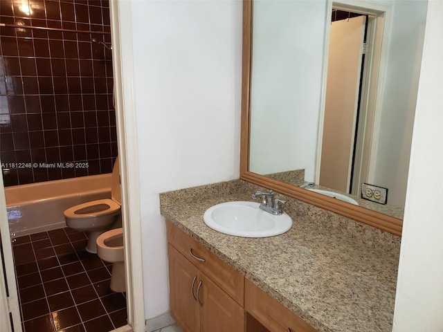 1240 La Mancha Ave, Coral Gables, FL 33134 - bathroom featuring toilet, vanity, tile patterned flooring, shower / washtub combination, and a bidet