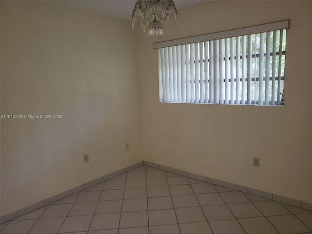 1240 La Mancha Ave, Coral Gables, FL 33134 - empty room featuring a chandelier and baseboards