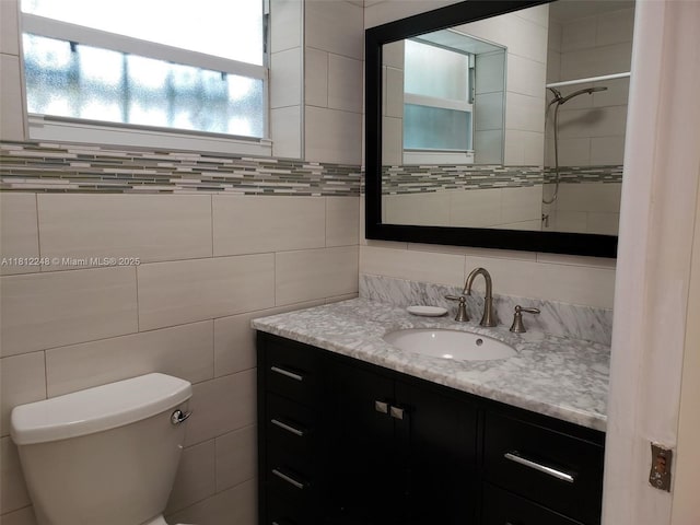 1240 La Mancha Ave, Coral Gables, FL 33134 - bathroom with vanity, toilet, and tile walls