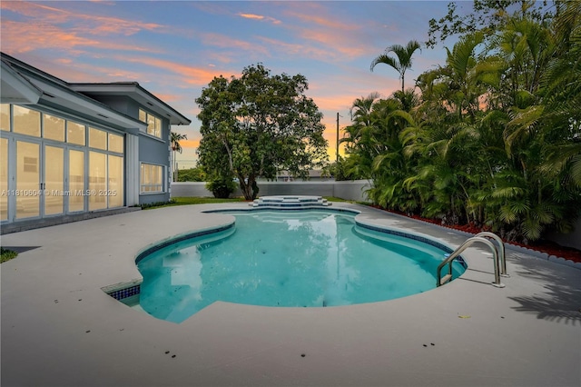 7201 SW 84th Pl, Miami, FL 33143 - pool at dusk with a patio