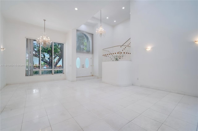 7201 SW 84th Pl, Miami, FL 33143 - unfurnished room with a chandelier, tile patterned flooring, a high ceiling, and recessed lighting