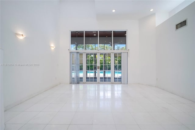 7201 SW 84th Pl, Miami, FL 33143 - unfurnished room with a high ceiling, french doors, tile patterned floors, and recessed lighting
