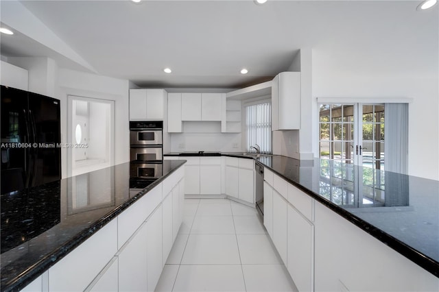 7201 SW 84th Pl, Miami, FL 33143 - kitchen with open shelves, black appliances, dark stone countertops, recessed lighting, and white cabinetry