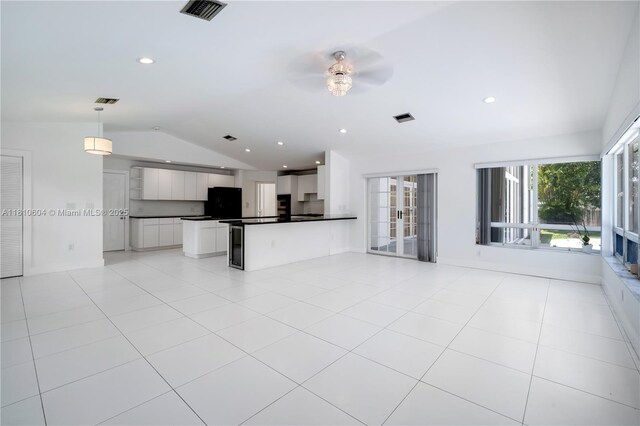 7201 SW 84th Pl, Miami, FL 33143 - unfurnished living room featuring vaulted ceiling, a ceiling fan, light tile patterned floors, and recessed lighting