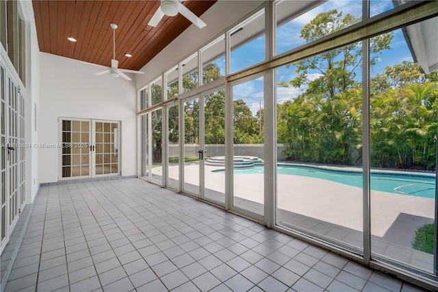 7201 SW 84th Pl, Miami, FL 33143 - unfurnished sunroom featuring a jacuzzi and view of wooded area