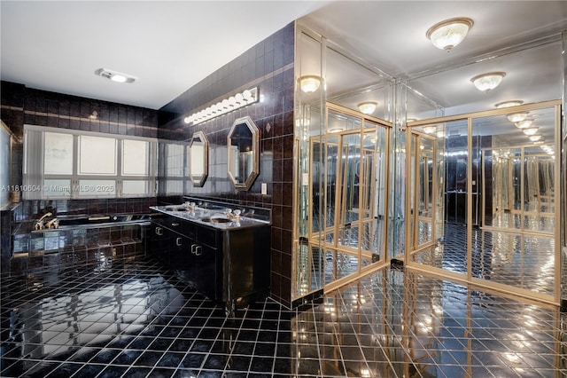 7201 SW 84th Pl, Miami, FL 33143 - bathroom featuring double vanity, tile patterned floors, and tile walls