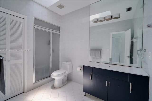 7201 SW 84th Pl, Miami, FL 33143 - bathroom featuring vanity, a stall shower, toilet, tile patterned floors, and a closet