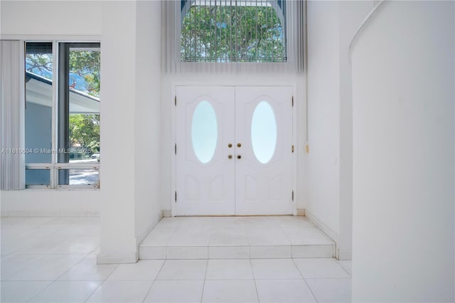 7201 SW 84th Pl, Miami, FL 33143 - tiled foyer entrance with baseboards and a towering ceiling