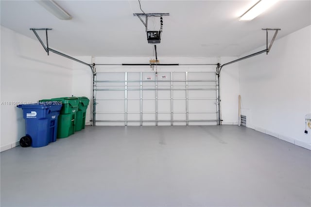 7201 SW 84th Pl, Miami, FL 33143 - garage featuring a garage door opener and baseboards