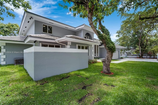 7201 SW 84th Pl, Miami, FL 33143 - view of front facade featuring stucco siding, a garage, a tile roof, and concrete driveway