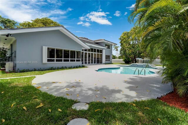 7201 SW 84th Pl, Miami, FL 33143 - outdoor pool with a patio area and a lawn