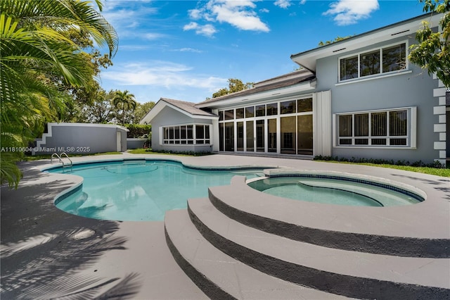7201 SW 84th Pl, Miami, FL 33143 - view of pool with a sunroom, a pool with connected hot tub, and a patio area