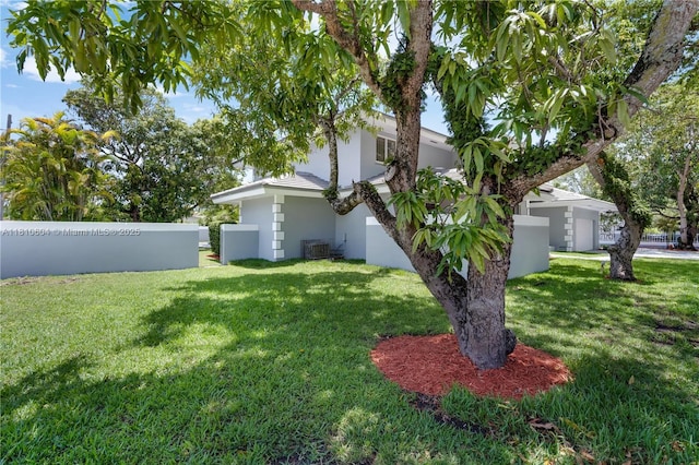 7201 SW 84th Pl, Miami, FL 33143 - view of grassy yard featuring central AC unit