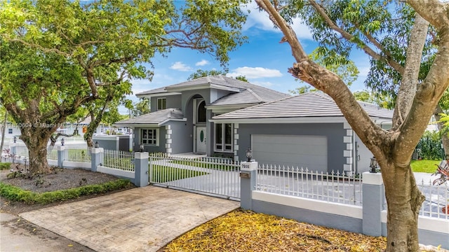 7201 SW 84th Pl, Miami, FL 33143 - view of front of home with an attached garage, decorative driveway, a fenced front yard, stucco siding, and a tiled roof