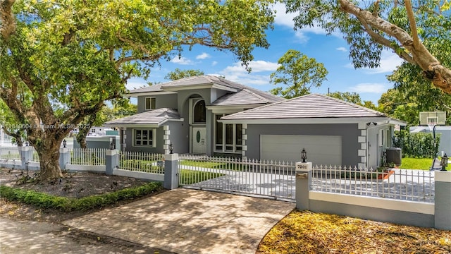 7201 SW 84th Pl, Miami, FL 33143 - view of front of home with an attached garage, central AC, a fenced front yard, and a tile roof