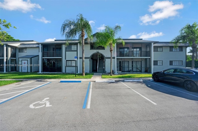 469 NE 207th Ln Unit 205, Miami, FL 33179 - view of property featuring uncovered parking